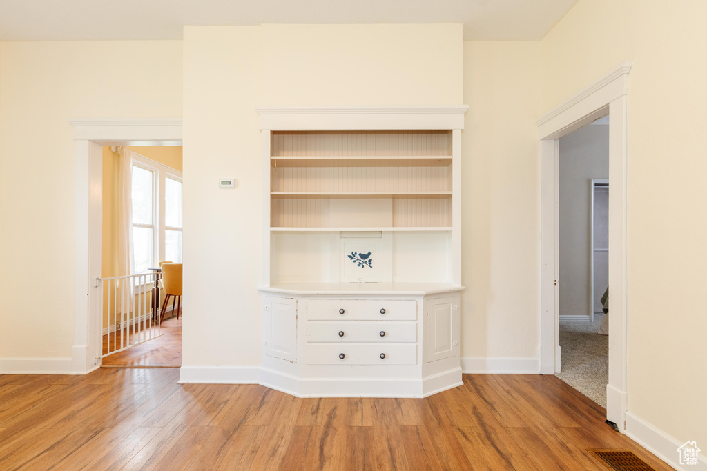 Detailed view of wood finished floors and baseboards