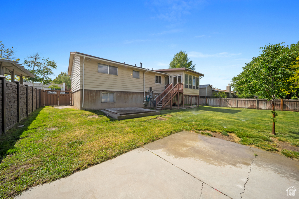 Rear view of property featuring a patio