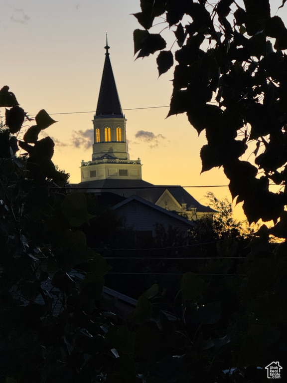 View of property at dusk