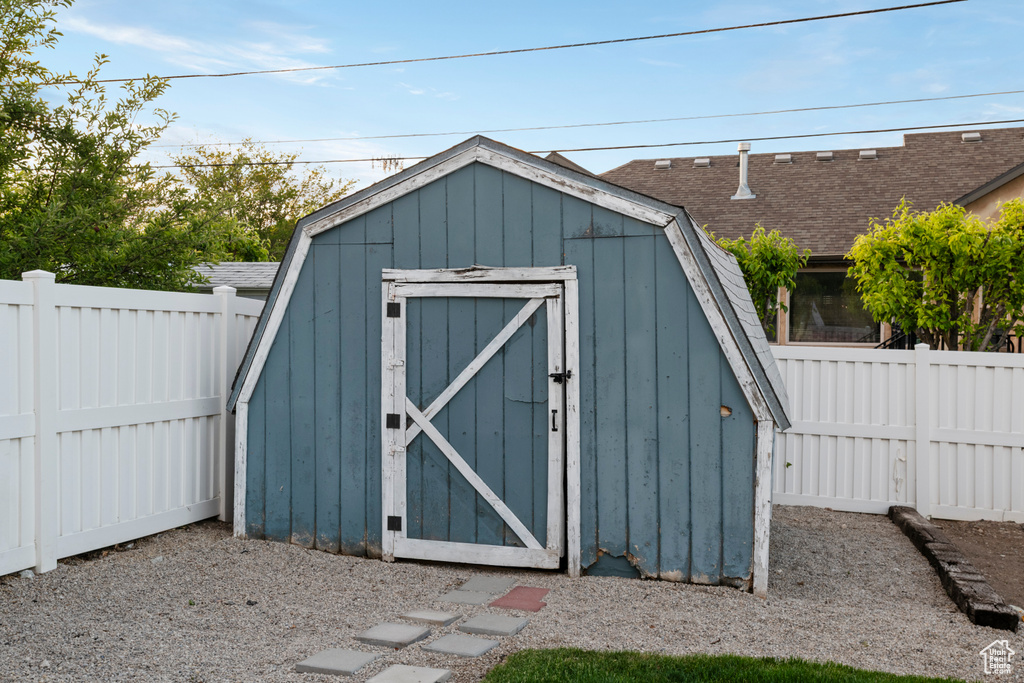 View of shed featuring a fenced backyard