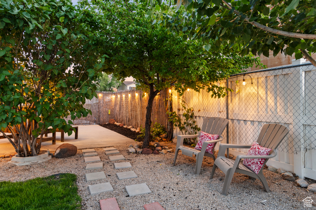 Fenced backyard with a patio
