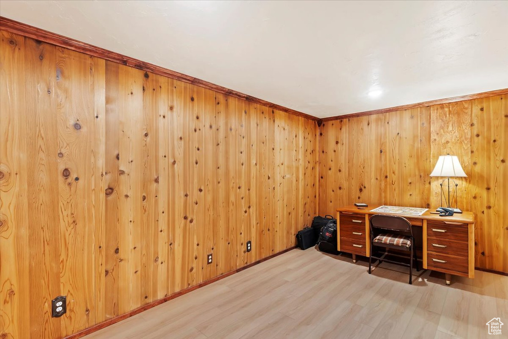 Office space featuring wood finished floors and wooden walls