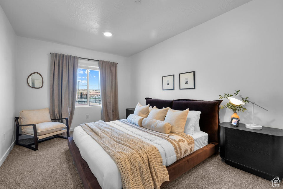 Bedroom featuring carpet flooring, baseboards, and recessed lighting