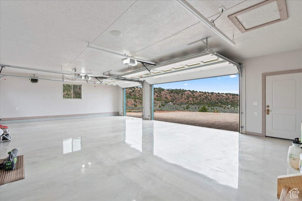 Garage featuring a garage door opener