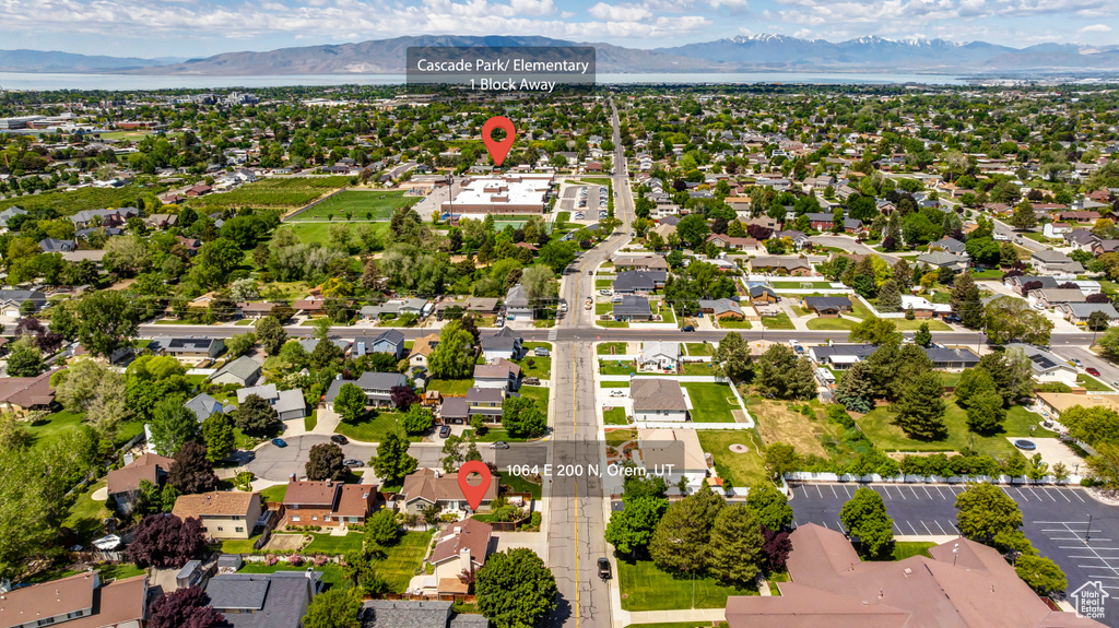 Aerial perspective of suburban area featuring a mountain backdrop
