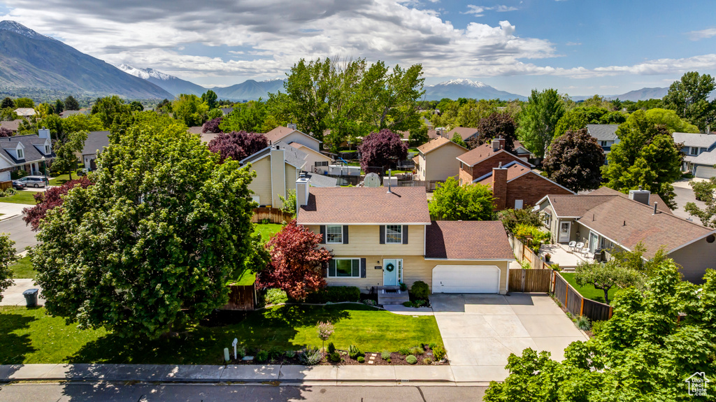 Aerial perspective of suburban area featuring a mountainous background