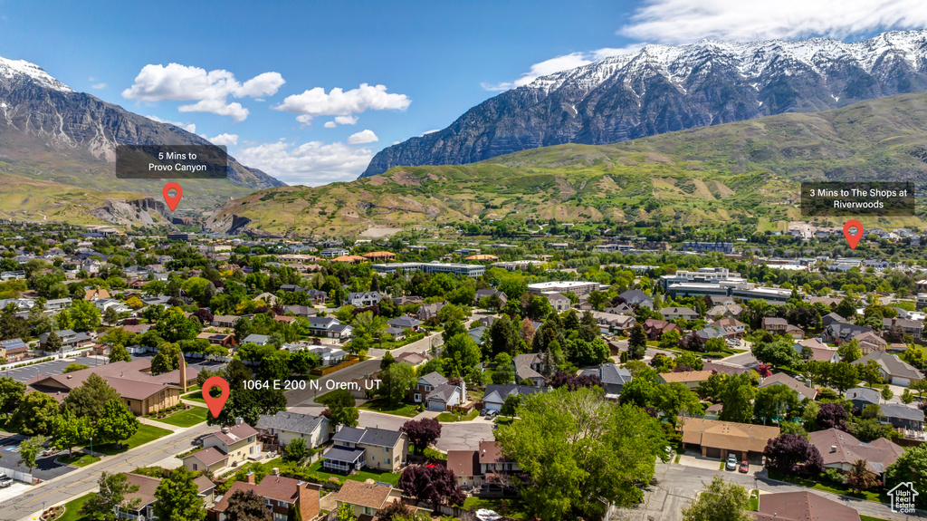 Aerial perspective of suburban area with a mountain backdrop