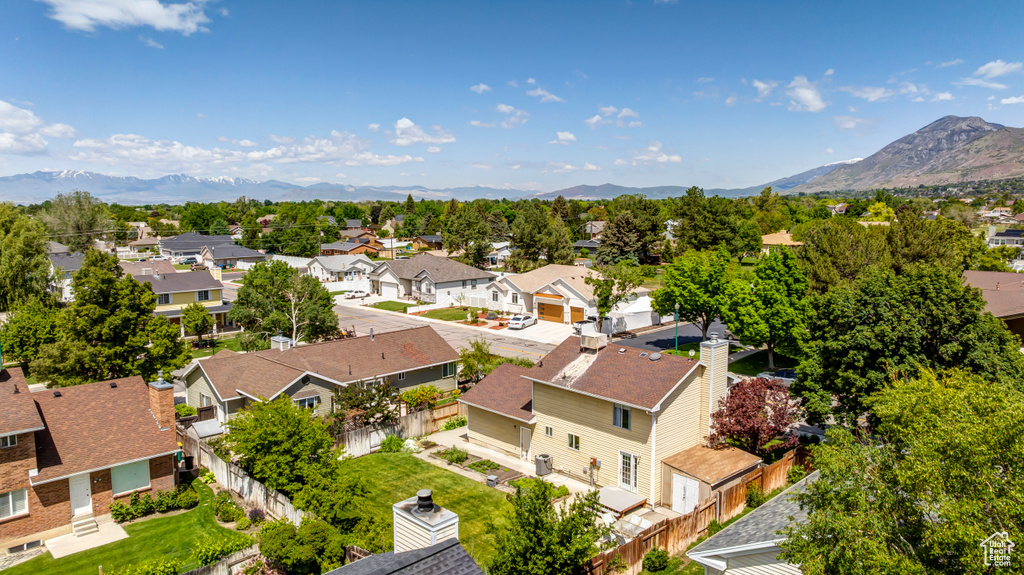 Aerial view of residential area featuring mountains