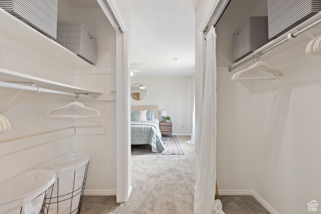 Spacious closet with carpet flooring