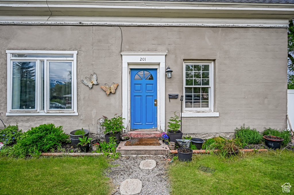 Property entrance with stucco siding