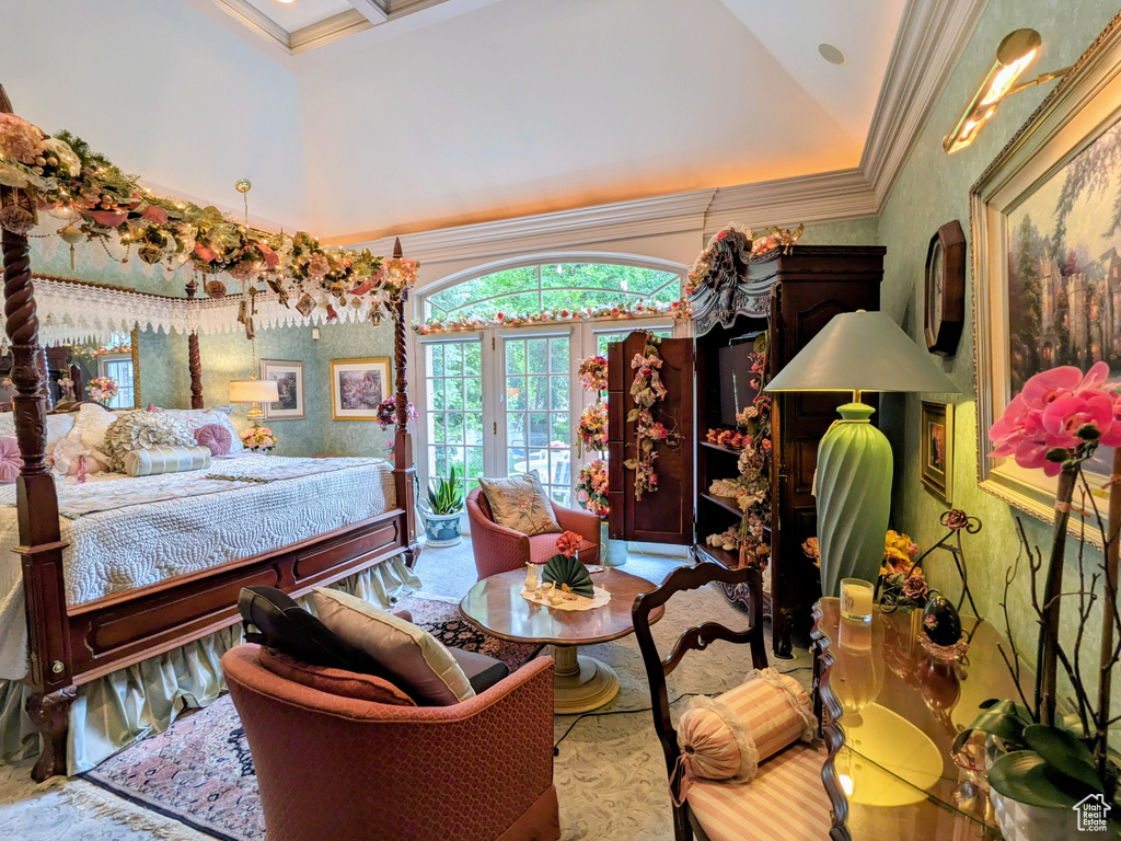 Bedroom with crown molding, access to exterior, a towering ceiling, and wallpapered walls