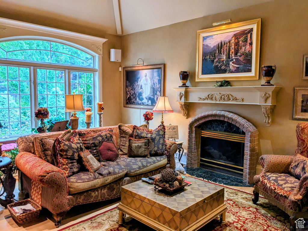 Living room featuring a brick fireplace