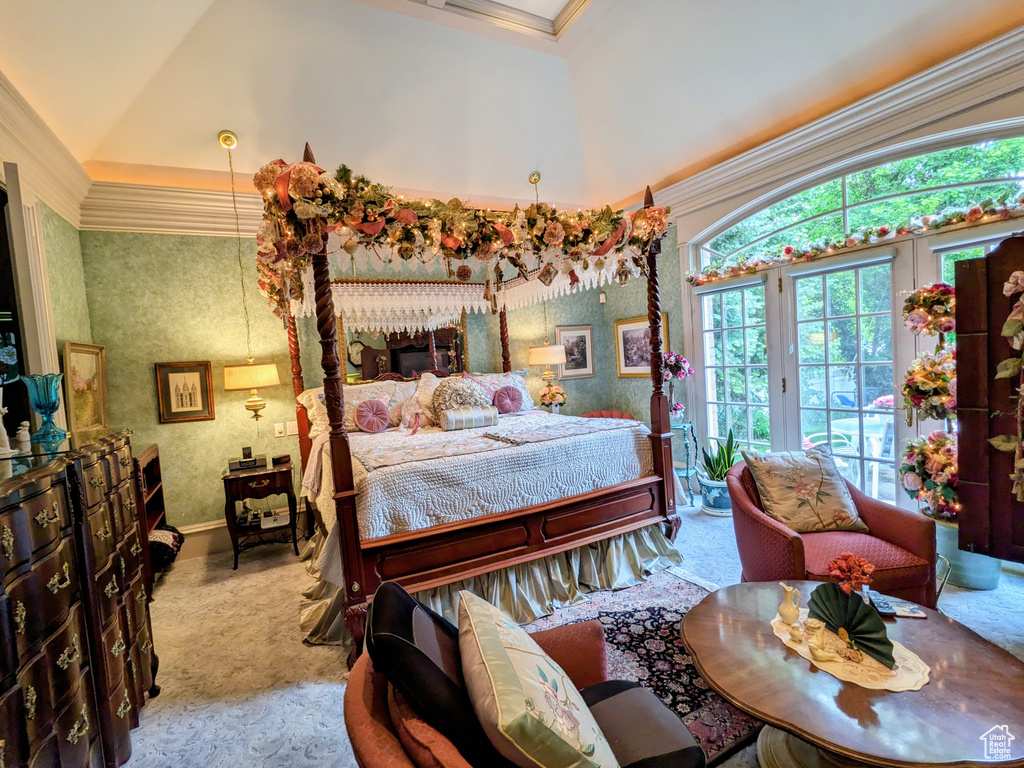 Carpeted bedroom featuring access to exterior, wallpapered walls, lofted ceiling, crown molding, and baseboards