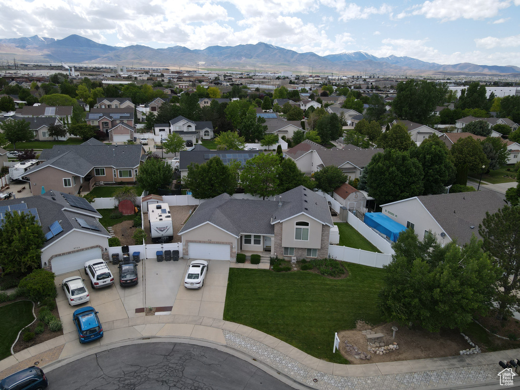 Aerial view of residential area featuring a mountainous background