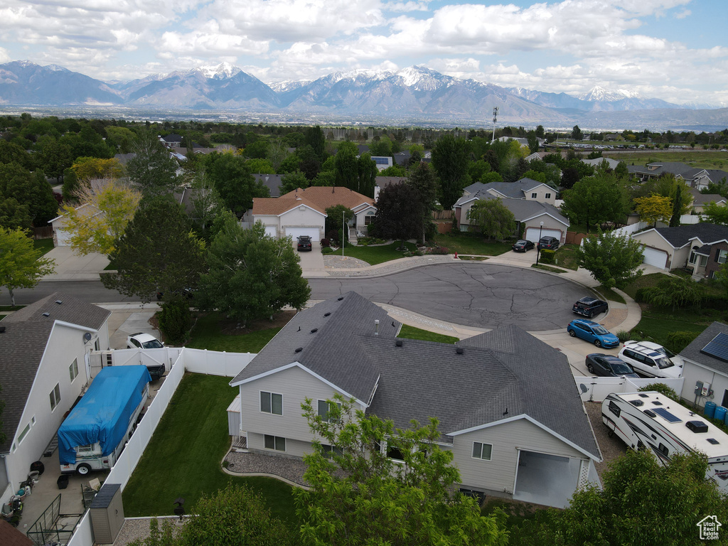 Aerial view of residential area with a mountainous background