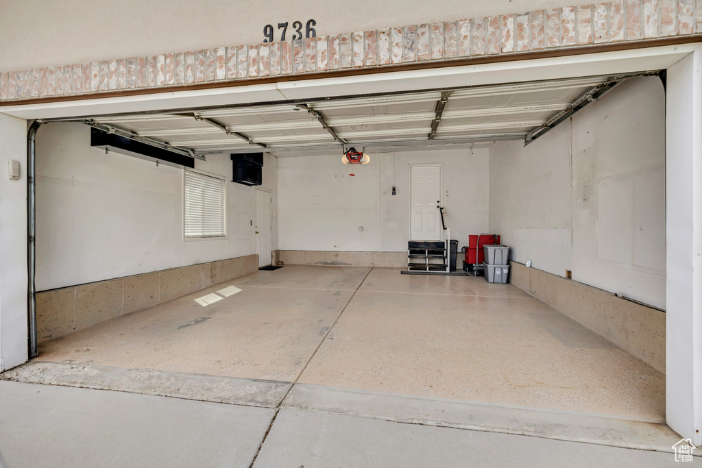 Garage featuring a garage door opener