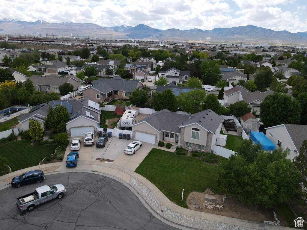 Aerial view of residential area featuring a mountain backdrop