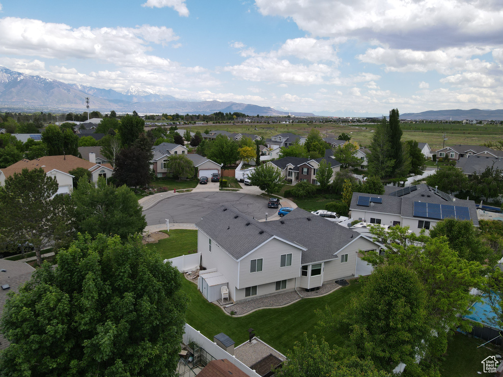 Aerial view of residential area featuring a mountain backdrop