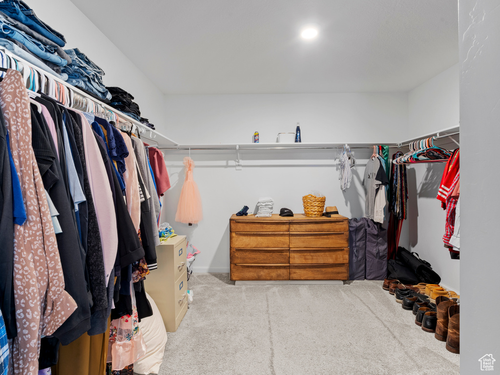 Spacious closet with carpet floors