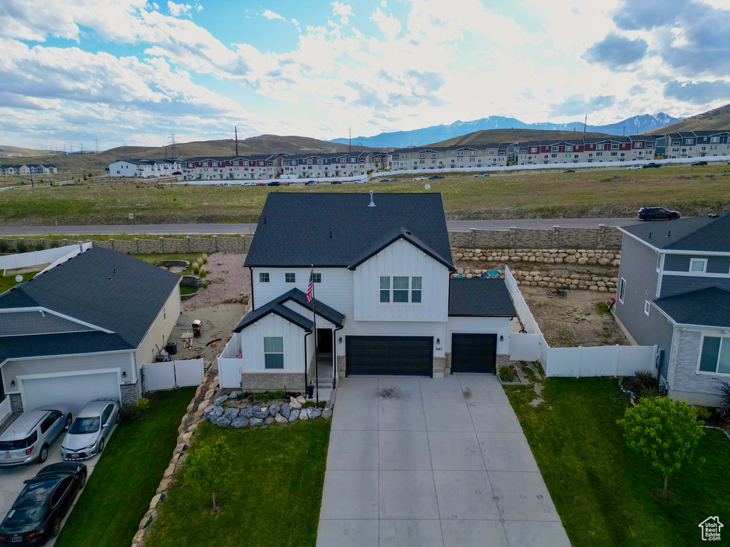 View from above of property with a mountain backdrop