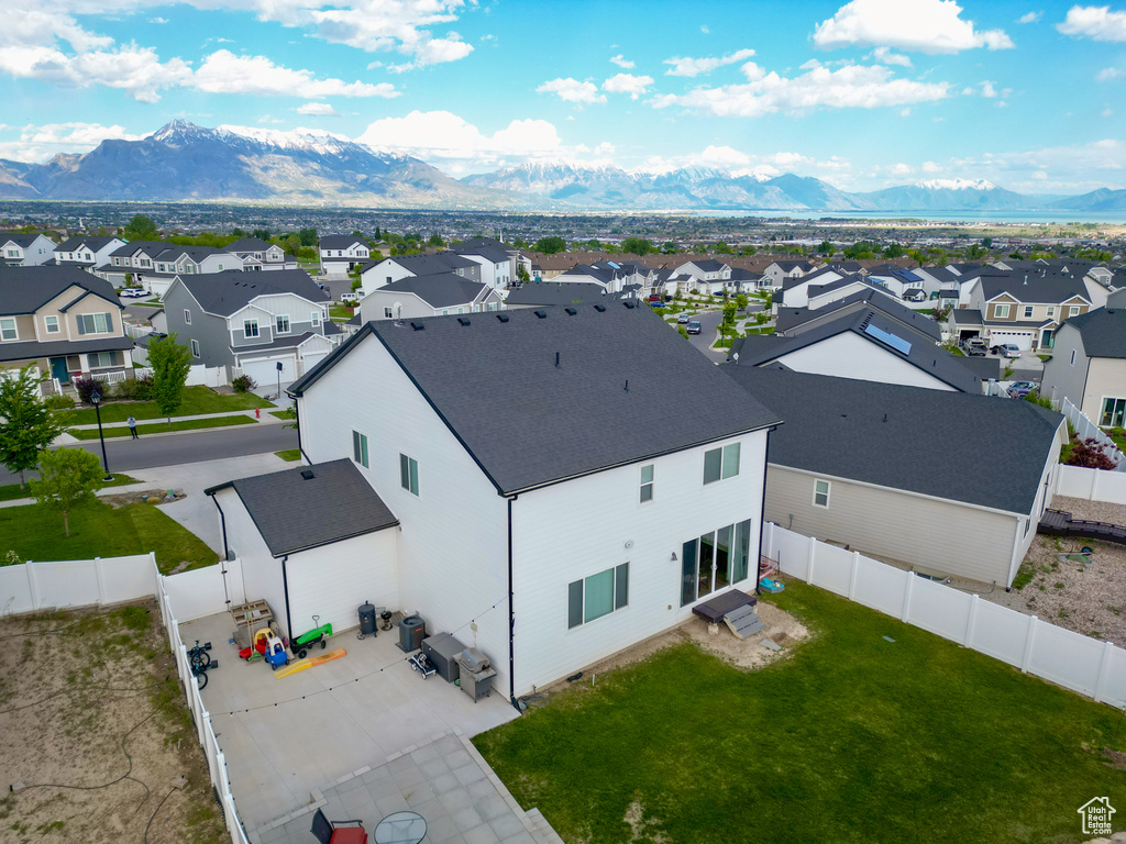 Aerial perspective of suburban area featuring a mountainous background