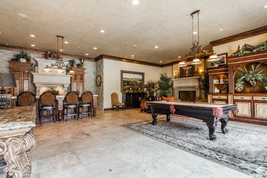 Playroom with a fireplace, ornamental molding, billiards table, and recessed lighting