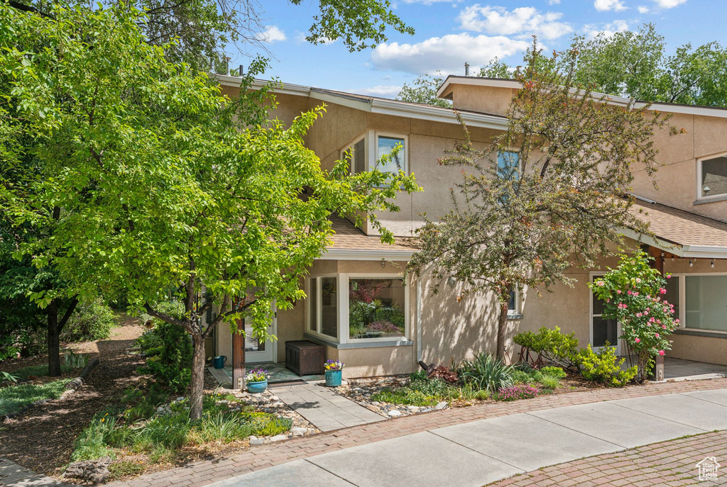 View of front of house featuring stucco siding