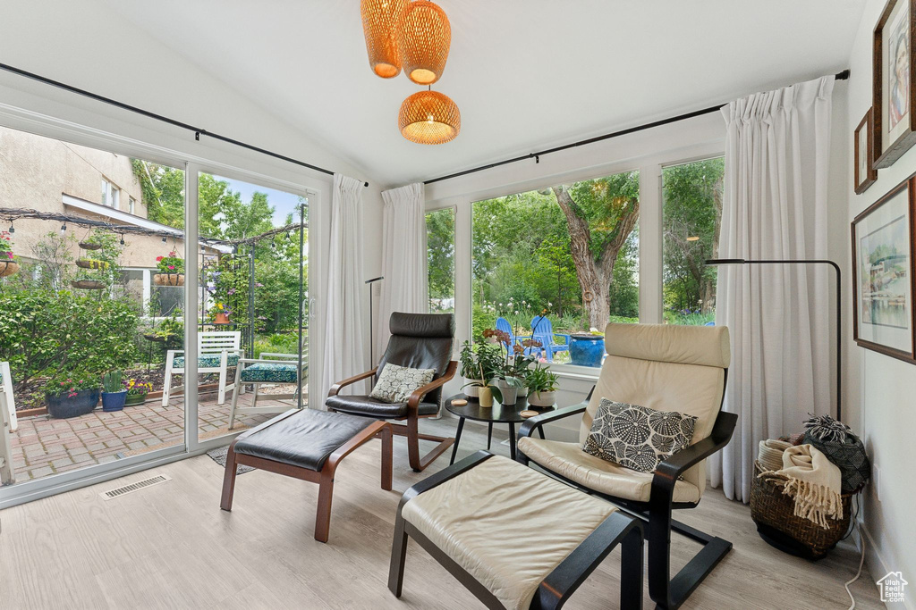 Sunroom / solarium with lofted ceiling