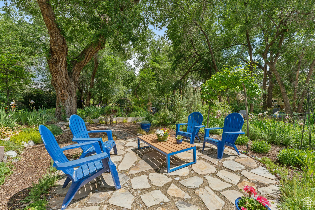 View of patio / terrace with view of wooded area