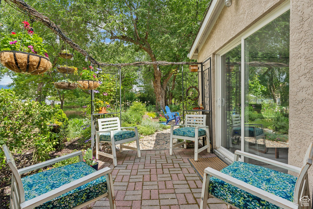 View of patio / terrace featuring view of wooded area