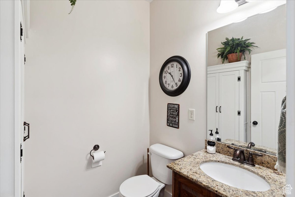 Half bath with toilet and vanity