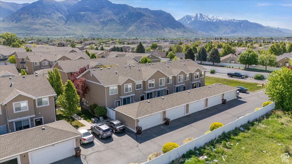 Aerial view of residential area featuring a mountainous background