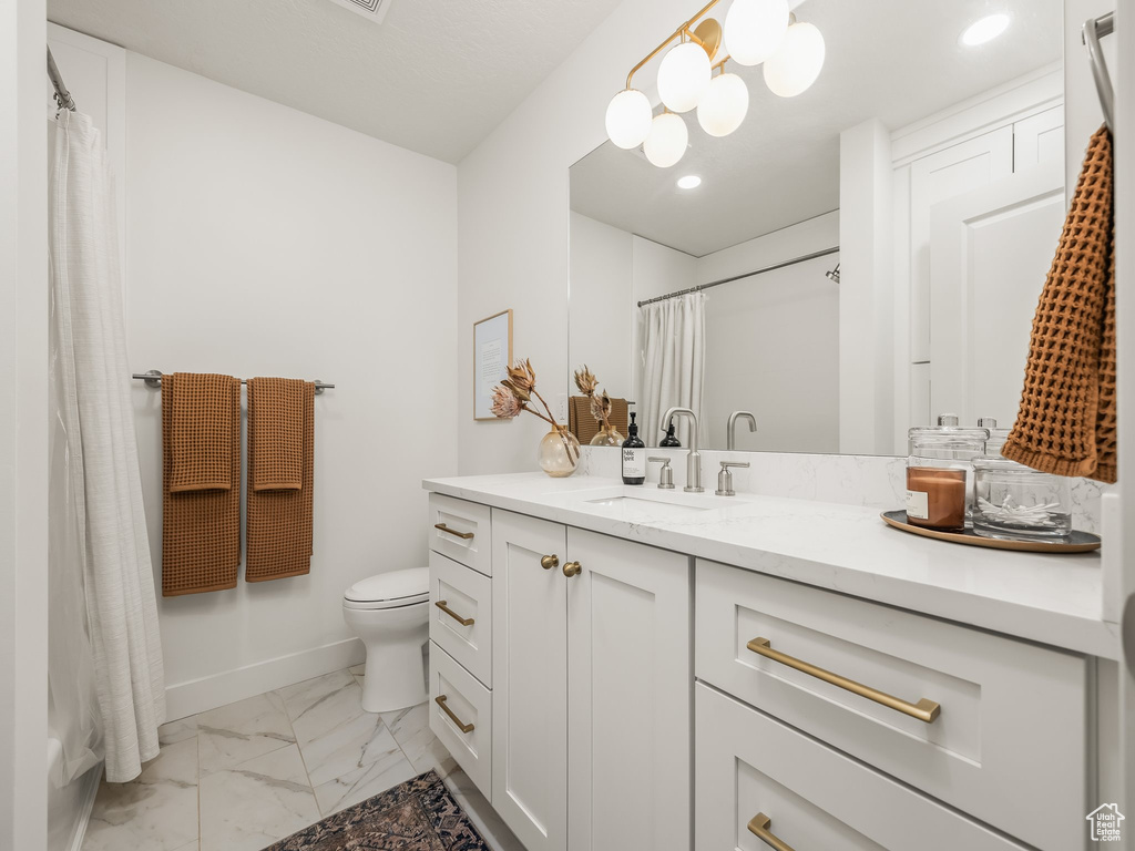 Full bath with marble finish flooring, vanity, toilet, recessed lighting, and a shower with shower curtain