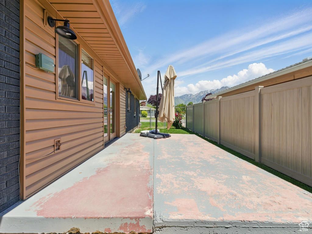 View of patio / terrace with a mountain view