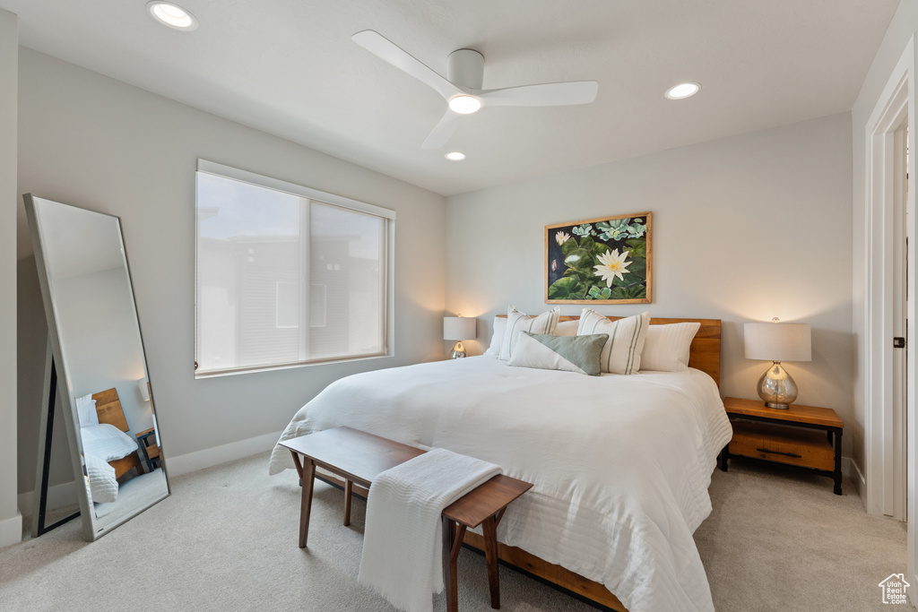 Bedroom with light carpet, recessed lighting, baseboards, and a ceiling fan