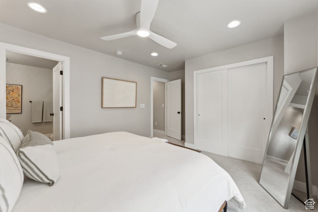 Bedroom featuring a closet, recessed lighting, a ceiling fan, baseboards, and light carpet