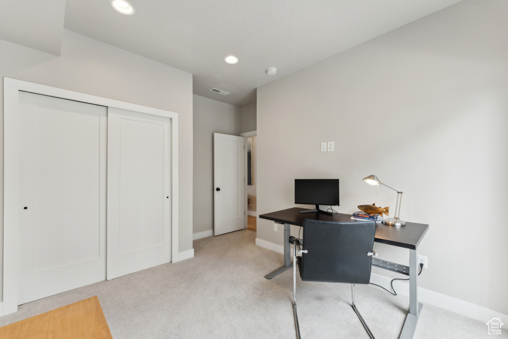 Home office featuring carpet flooring, baseboards, and recessed lighting