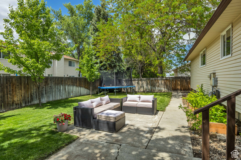 View of patio / terrace with an outdoor living space and a trampoline