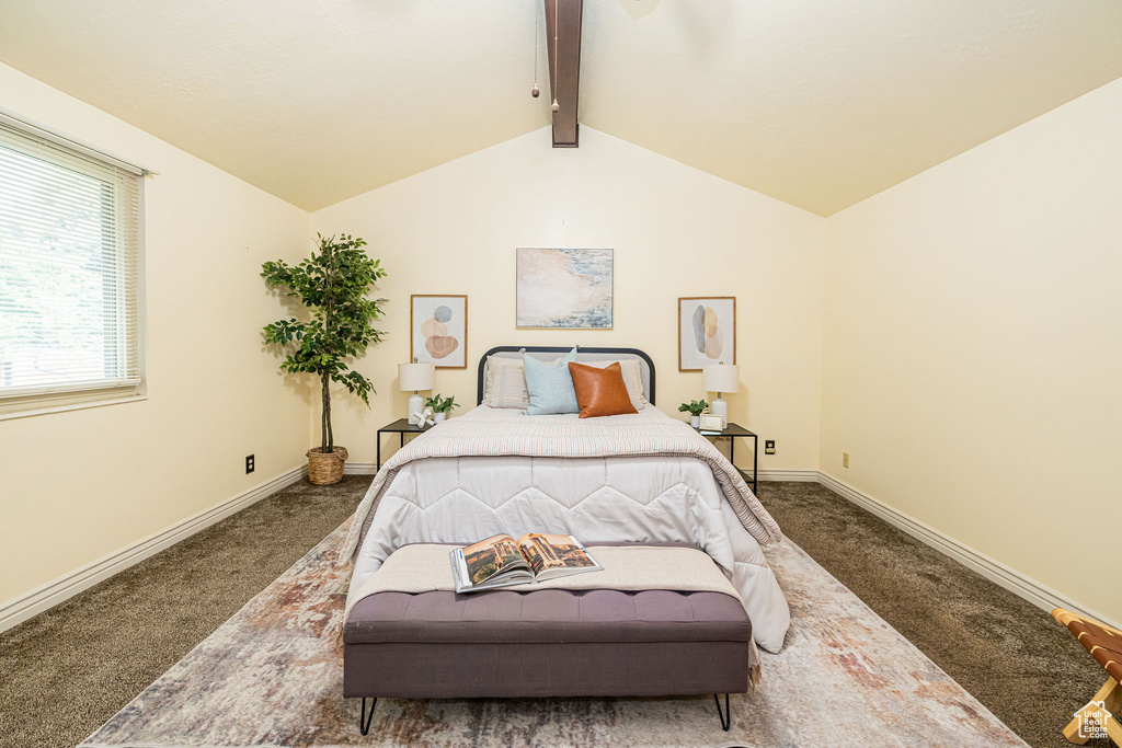 Bedroom featuring carpet floors and baseboards