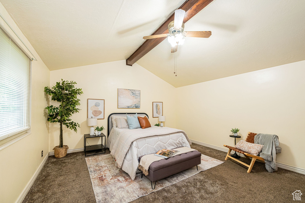 Carpeted bedroom featuring baseboards and ceiling fan