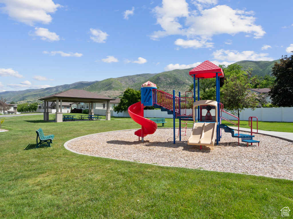 Community playground featuring a mountain view, a yard, and a gazebo
