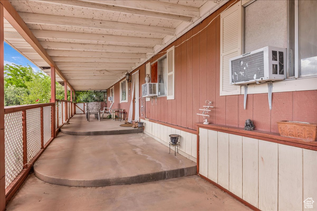 View of patio featuring cooling unit