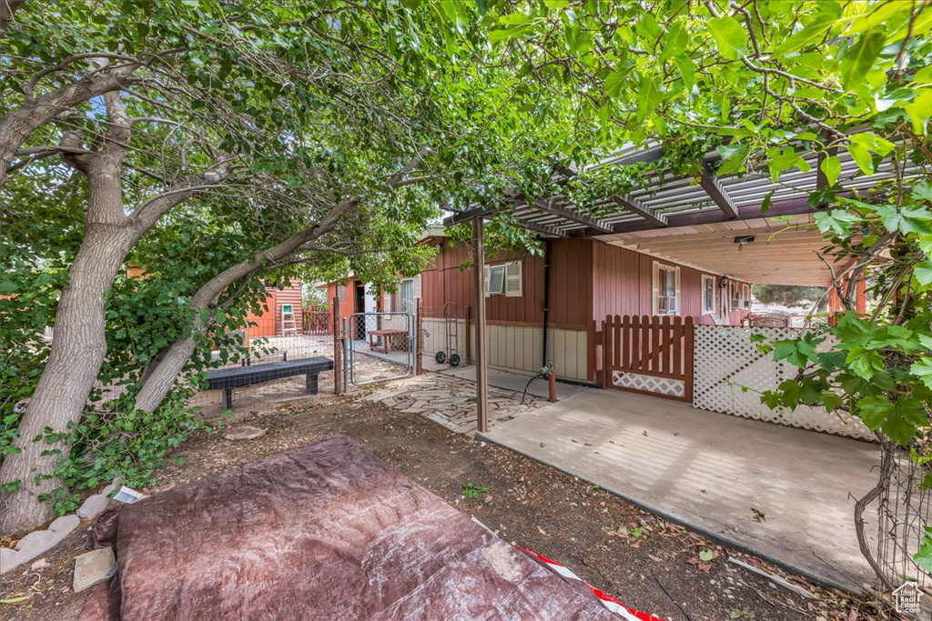 View of yard featuring a gate and fence