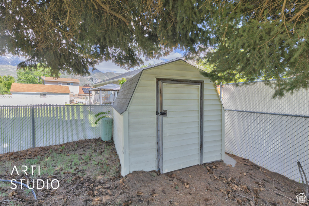 View of shed featuring a fenced backyard