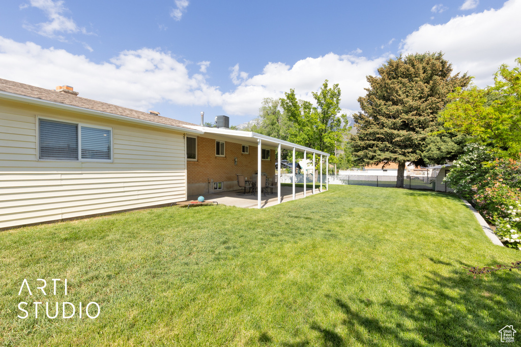 View of yard with a patio area