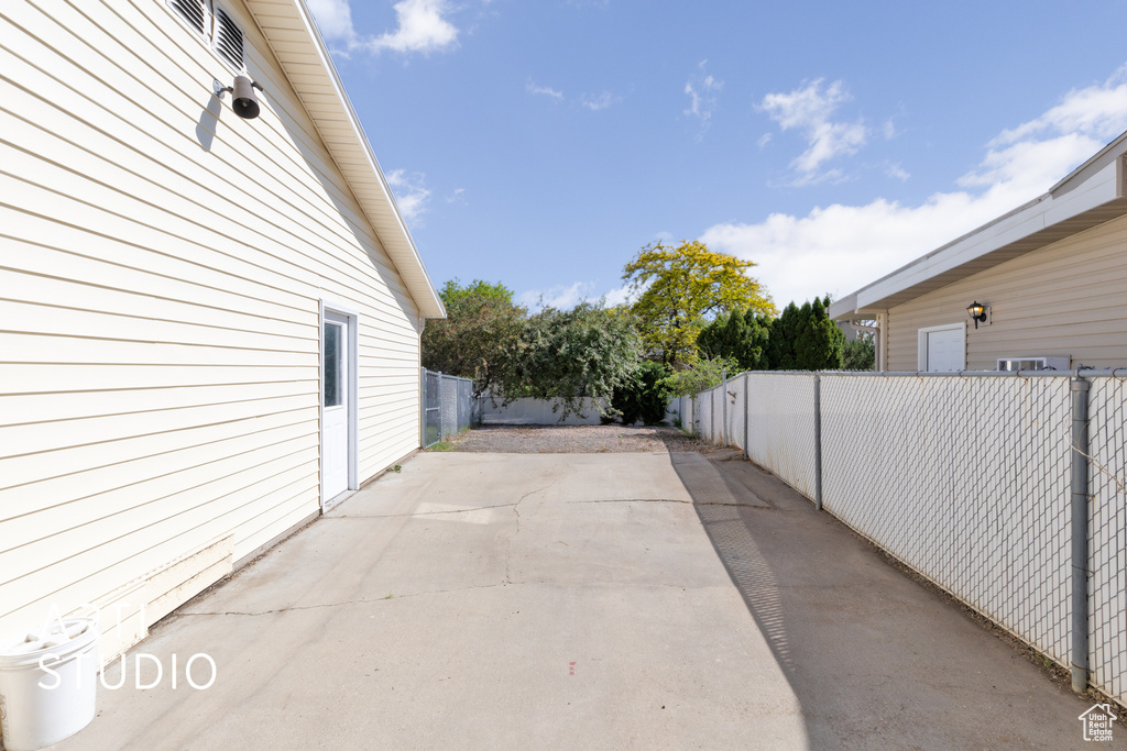 Fenced backyard with a patio area