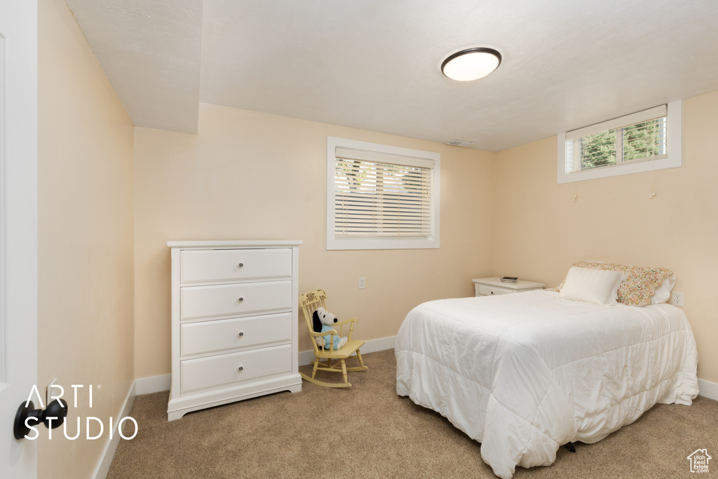Carpeted bedroom with baseboards
