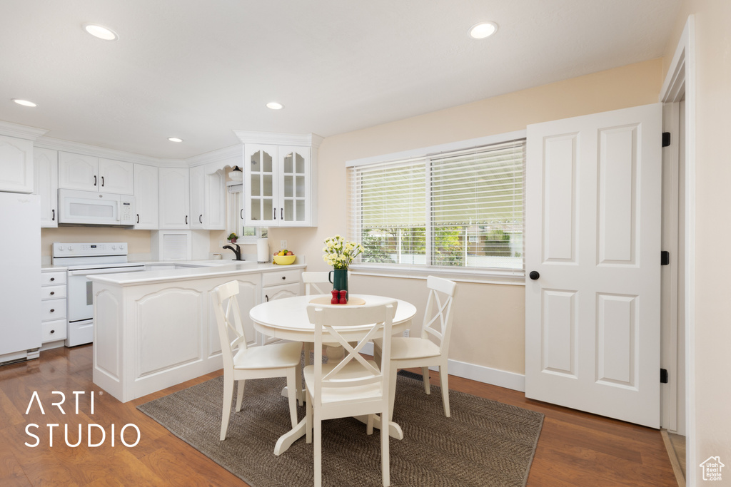 Dining space featuring recessed lighting, dark wood-style floors, and baseboards