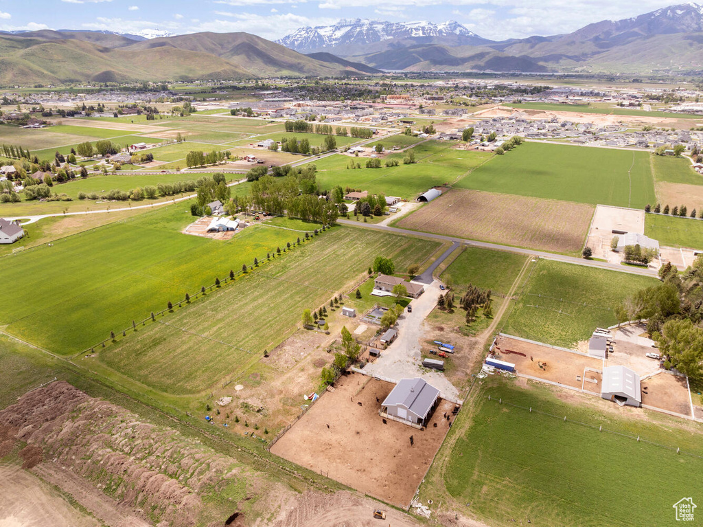 Aerial view of property\'s location with rural landscape and a mountainous background