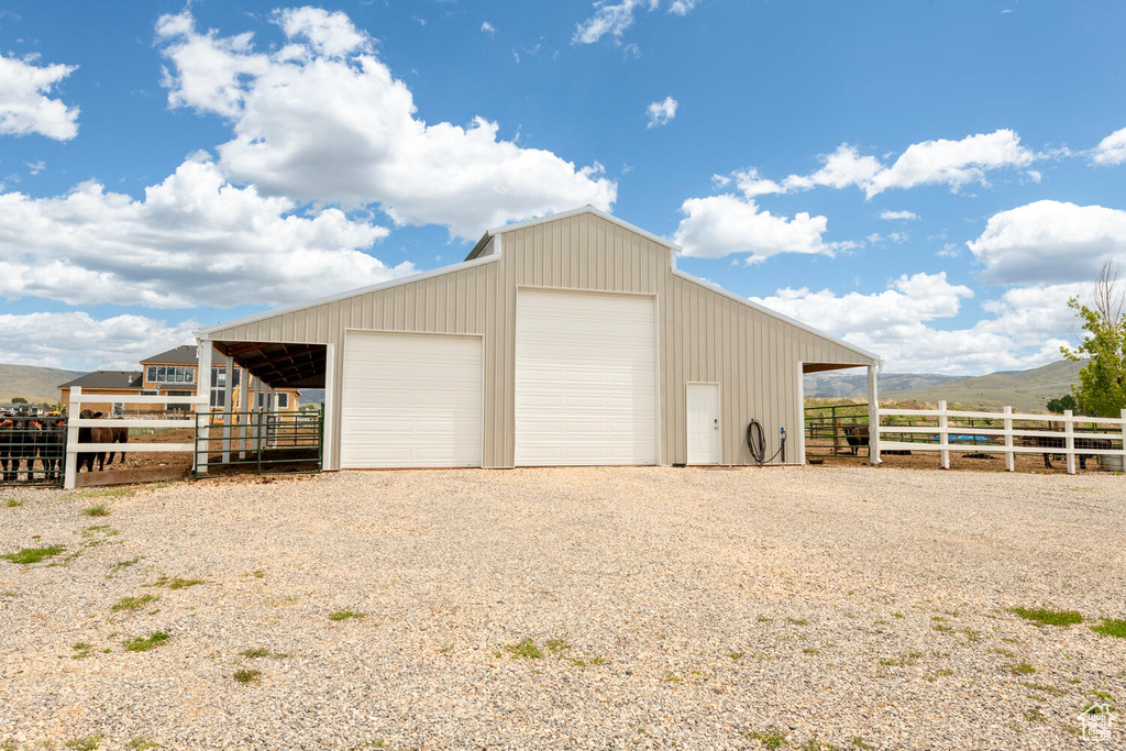 Garage featuring a garage and a mountain view